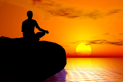 Meditation silhouette at sunset